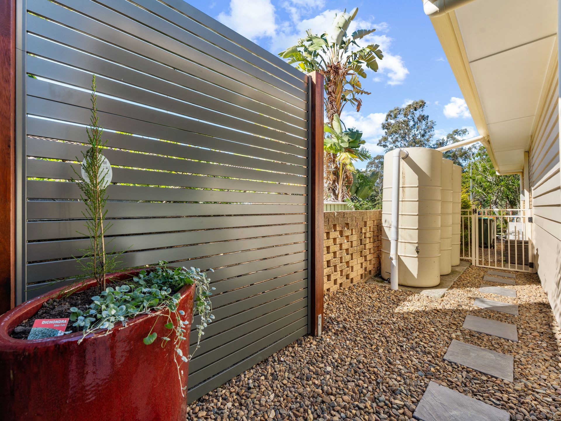 Wishart extension outdoor area with slatted privacy fence