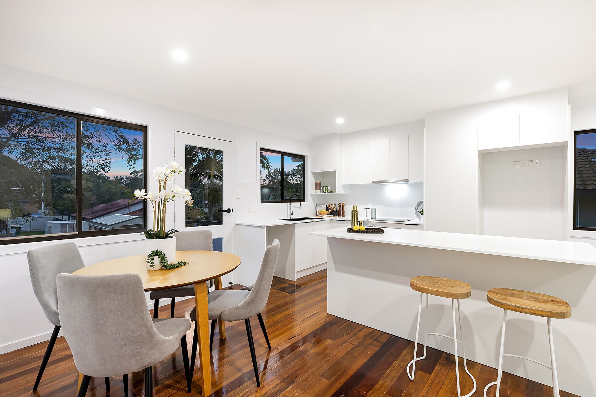 Finished bright white kitchen and dining room