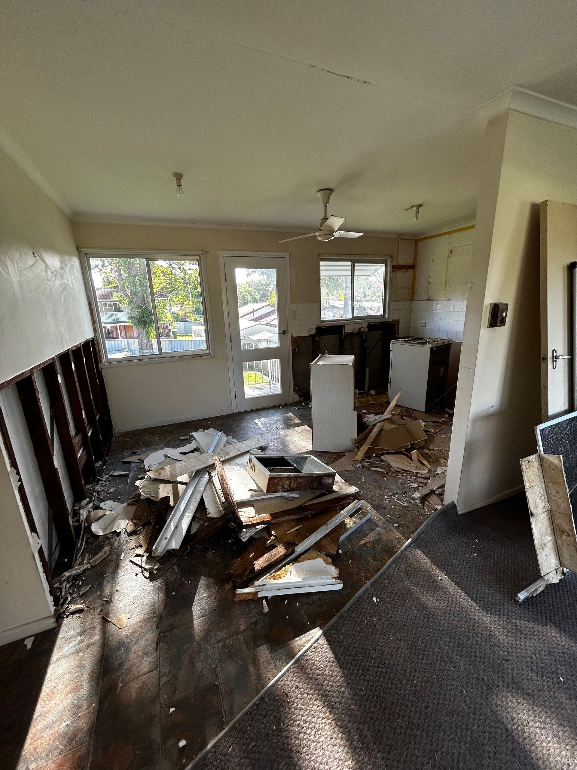 Interior of a room stripped back to studs during demolition
